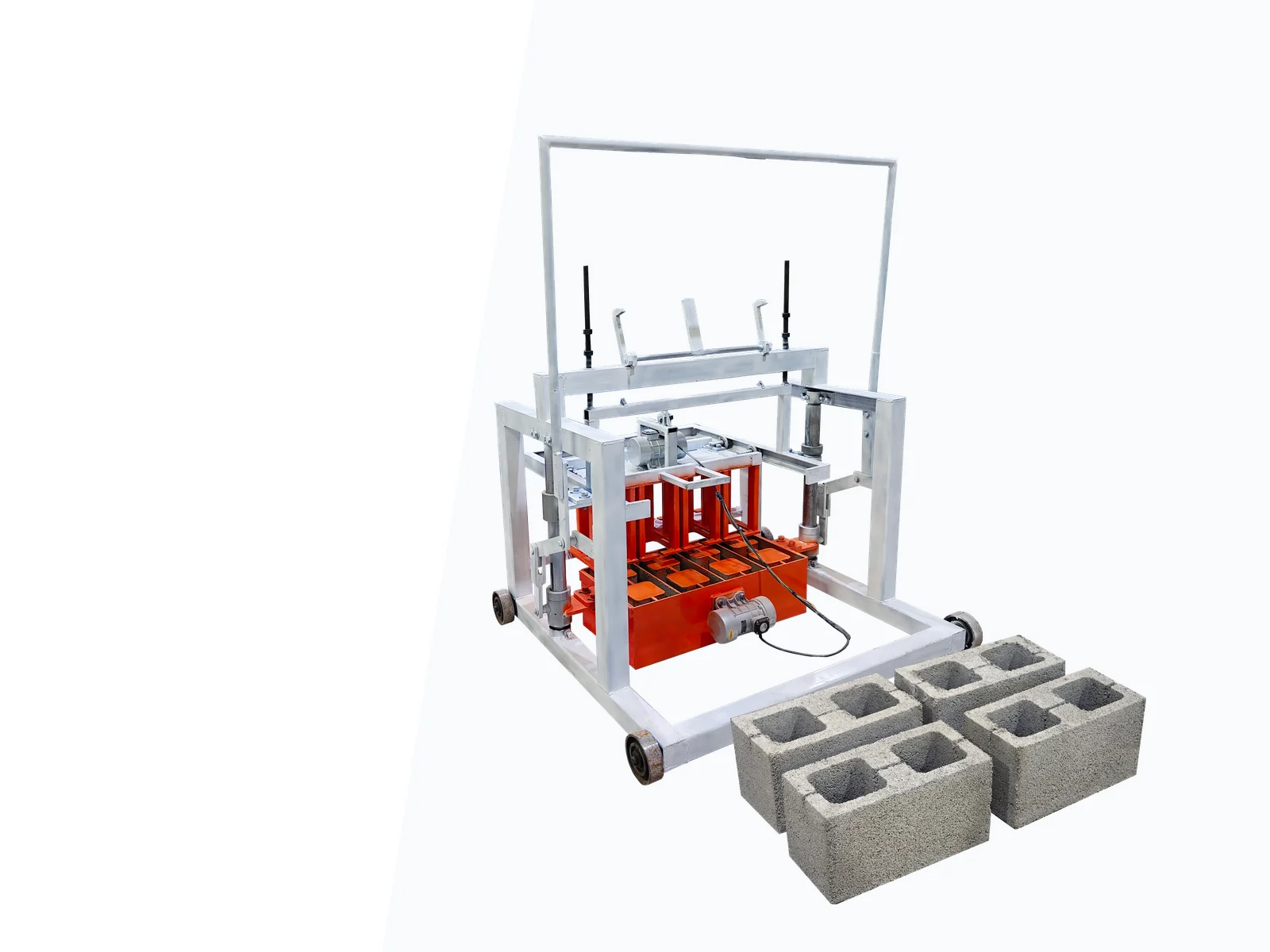 Manual hollow block machine with white steel frame and orange mold area