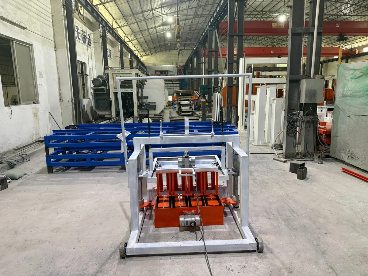 Manual hollow block machine with white steel frame and orange mold area